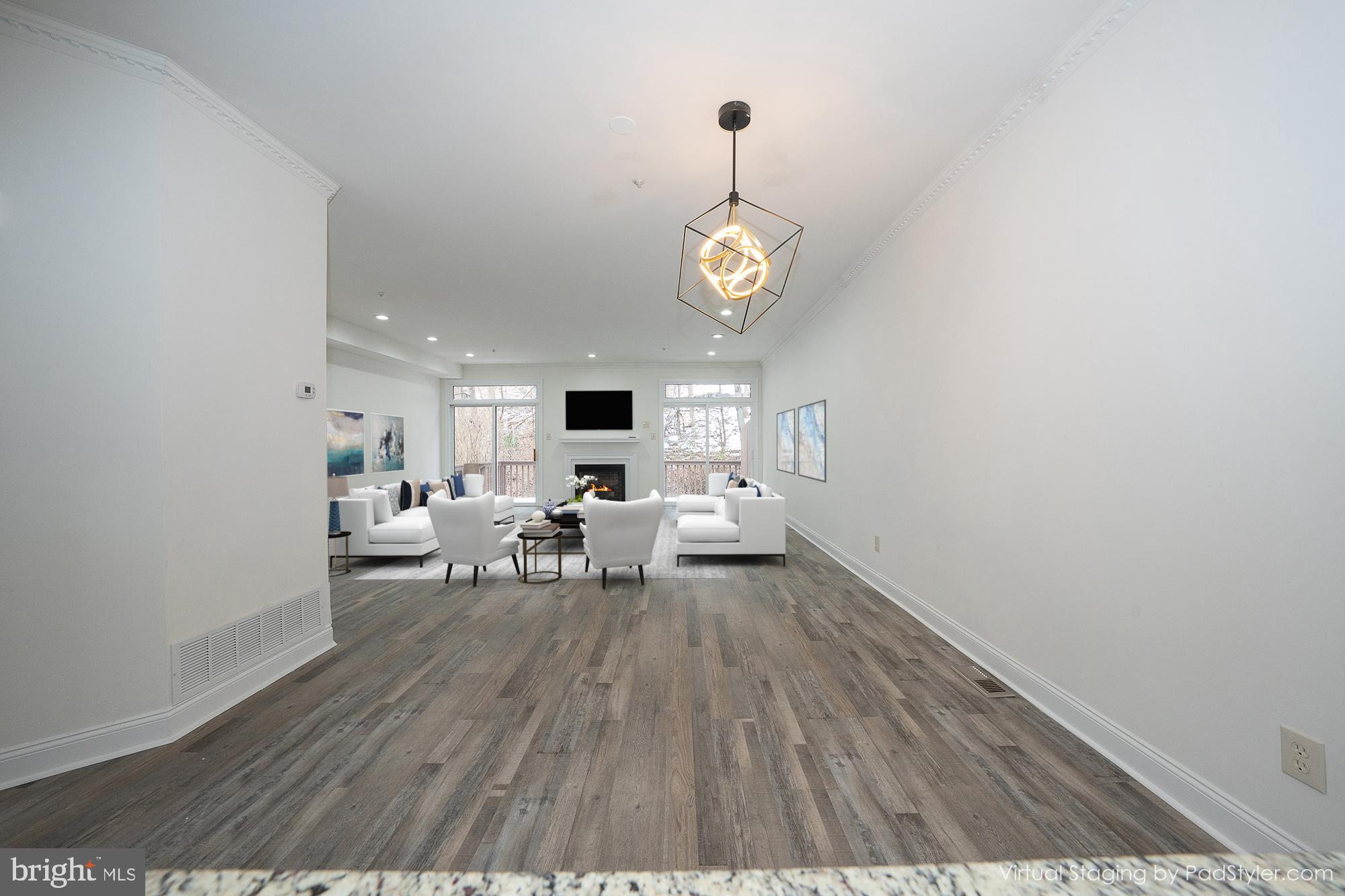 514 Waters Edge Newtown Square, PA 19073 - Photo 29 of 29 a living room with furniture and a wooden floor