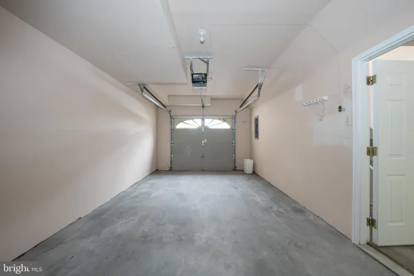 a view of a hallway with closet and utility room