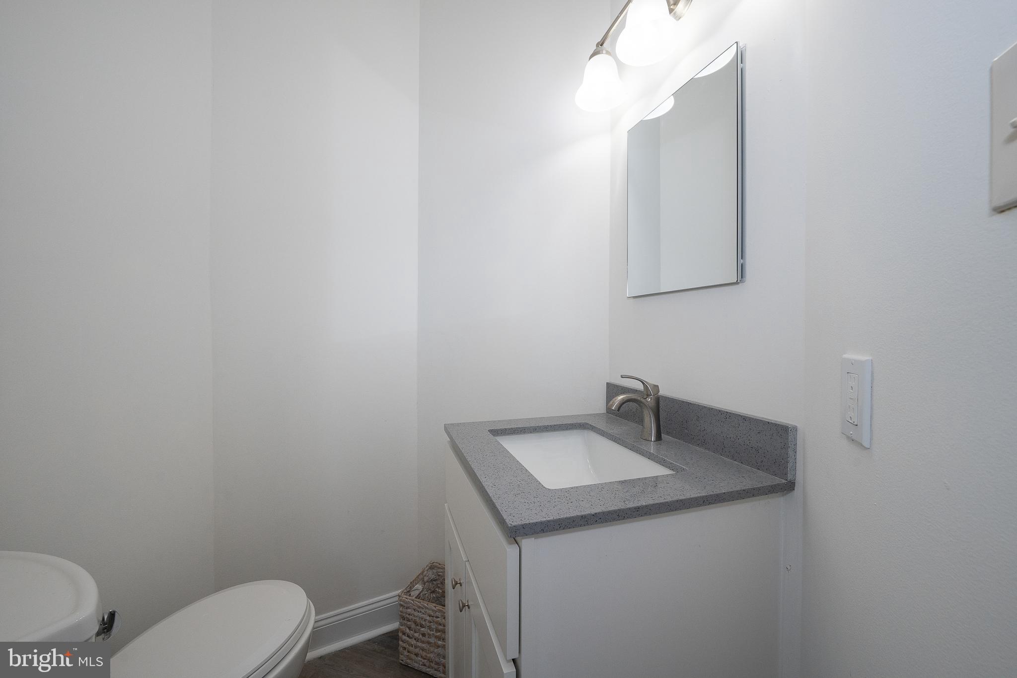 514 Waters Edge Newtown Square, PA 19073 - Photo 8 of 29 a bathroom with a toilet sink and mirror