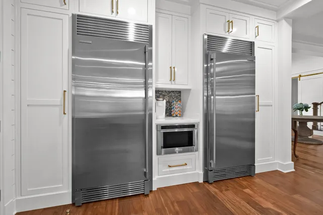 a kitchen with a refrigerator and an oven