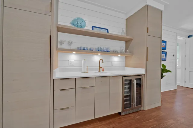 a bathroom with a double vanity sink a toilet and shower