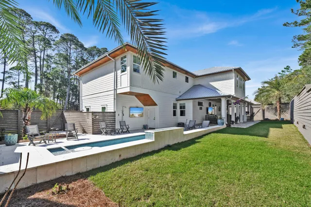 a kitchen with a sink window and cabinets