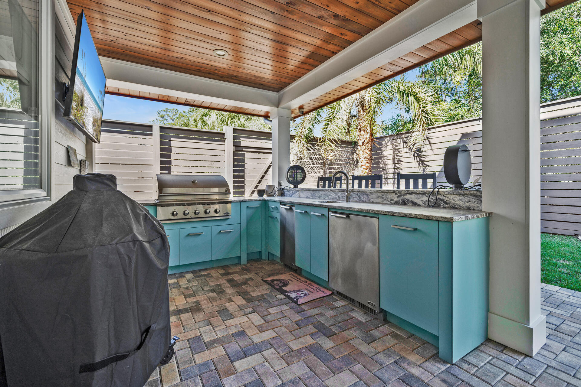 290 Seabreeze Boulevard Inlet Beach, FL 32461 - Photo 36 of 43 a kitchen with a sink window and cabinets