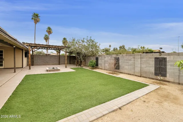 a view of a backyard with a patio