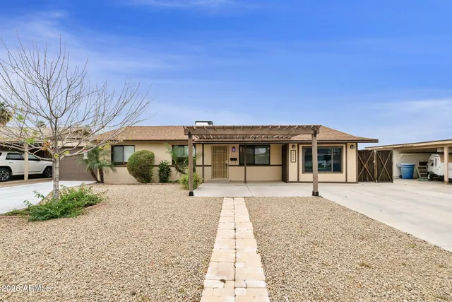 a front view of a house with a patio