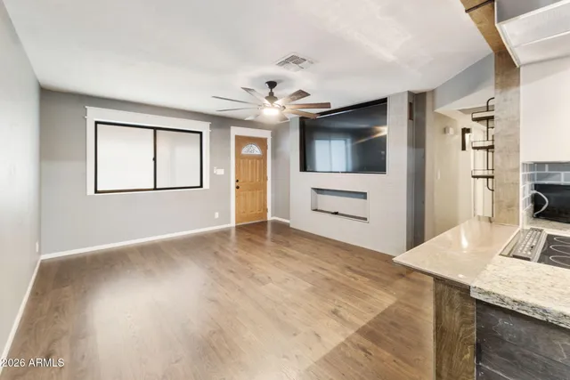 a view of livingroom with hardwood floor and a ceiling fan