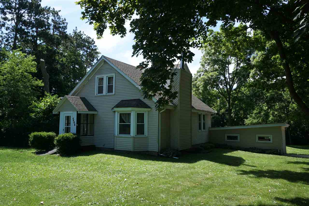 4486 Safford Road Rockford, IL 61101 - Photo 1 of 19 a view of backyard with garden