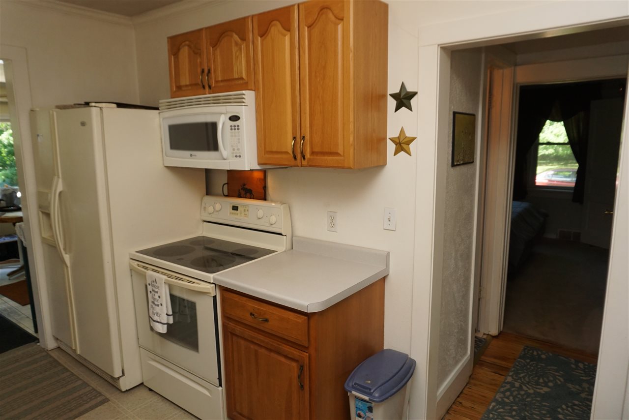 4486 Safford Road Rockford, IL 61101 - Photo 16 of 19 a kitchen with a stove and a microwave