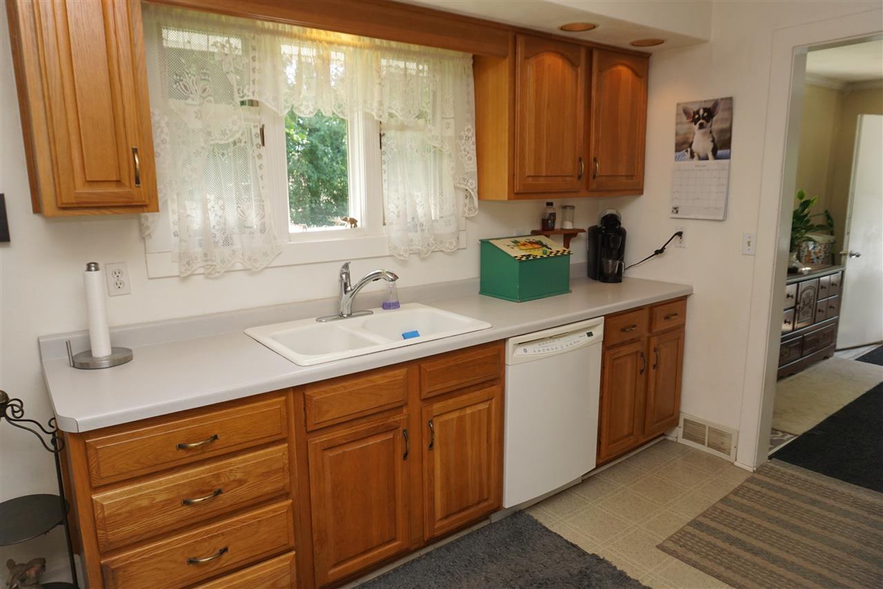 4486 Safford Road Rockford, IL 61101 - Photo 3 of 19 a kitchen with stainless steel appliances granite countertop a sink a stove and cabinets