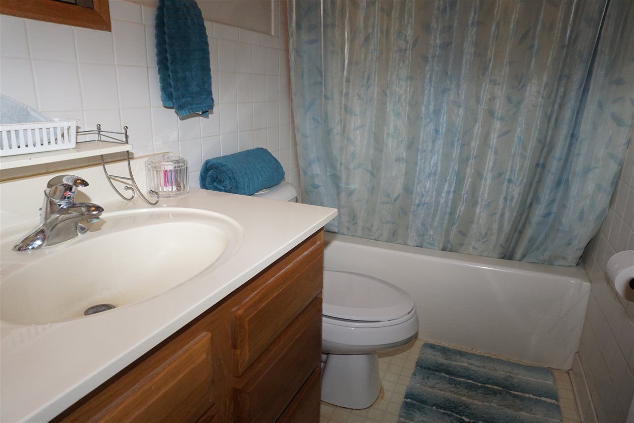 4486 Safford Road Rockford, IL 61101 - Photo 4 of 19 a bathroom with a sink a toilet and vanity