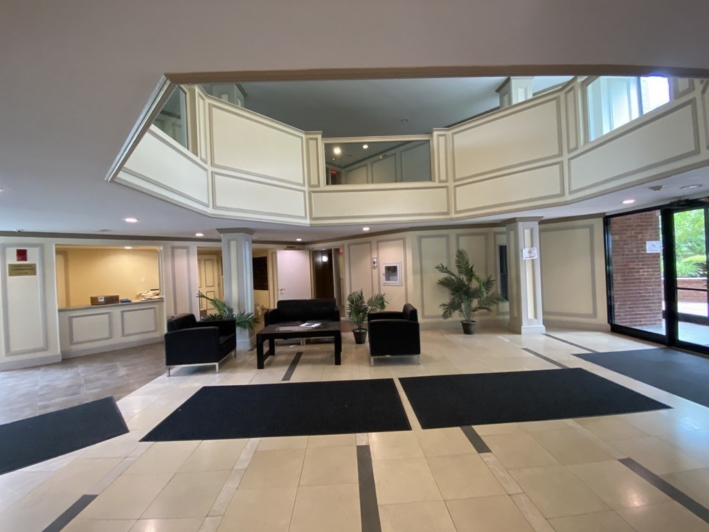 85 Brainerd Road, Unit 510 Boston, MA 02134 - Photo 24 of 25 a view of a lobby with black and white walls
