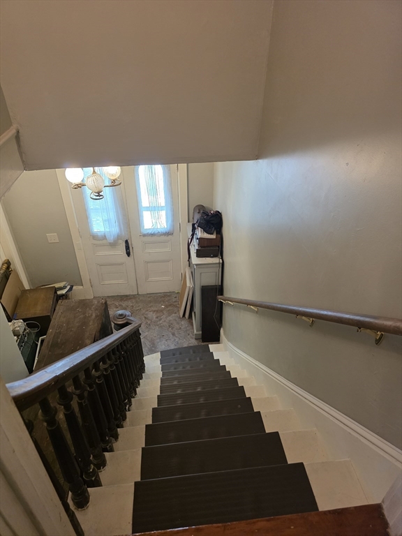48 Maple Street, Unit 2 Holden, MA 01520 - Photo 2 of 11 a view of a hallway with staircase