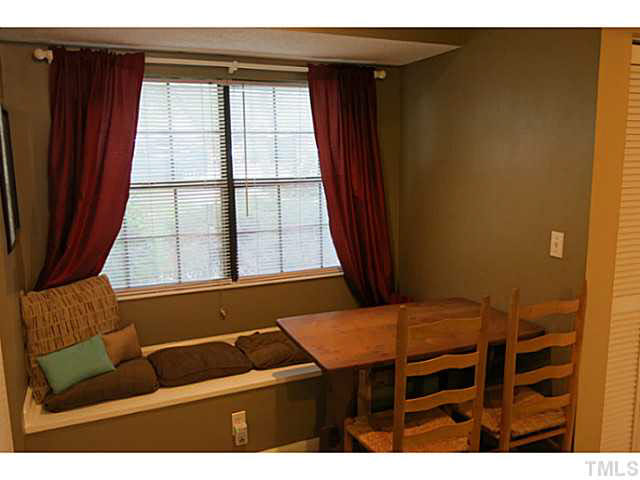 2403 Condor Court, Unit 2403 Raleigh, NC 27615 - Photo 13 of 25 a bedroom with a bed and a window