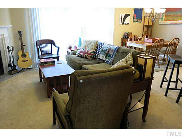 2403 Condor Court, Unit 2403 Raleigh, NC 27615 - Photo 8 of 25 a living room with furniture and wooden floor