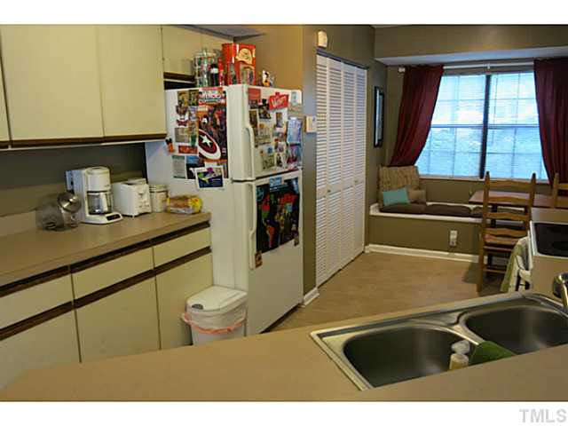 2403 Condor Court, Unit 2403 Raleigh, NC 27615 - Photo 10 of 25 a kitchen with a sink and a stove