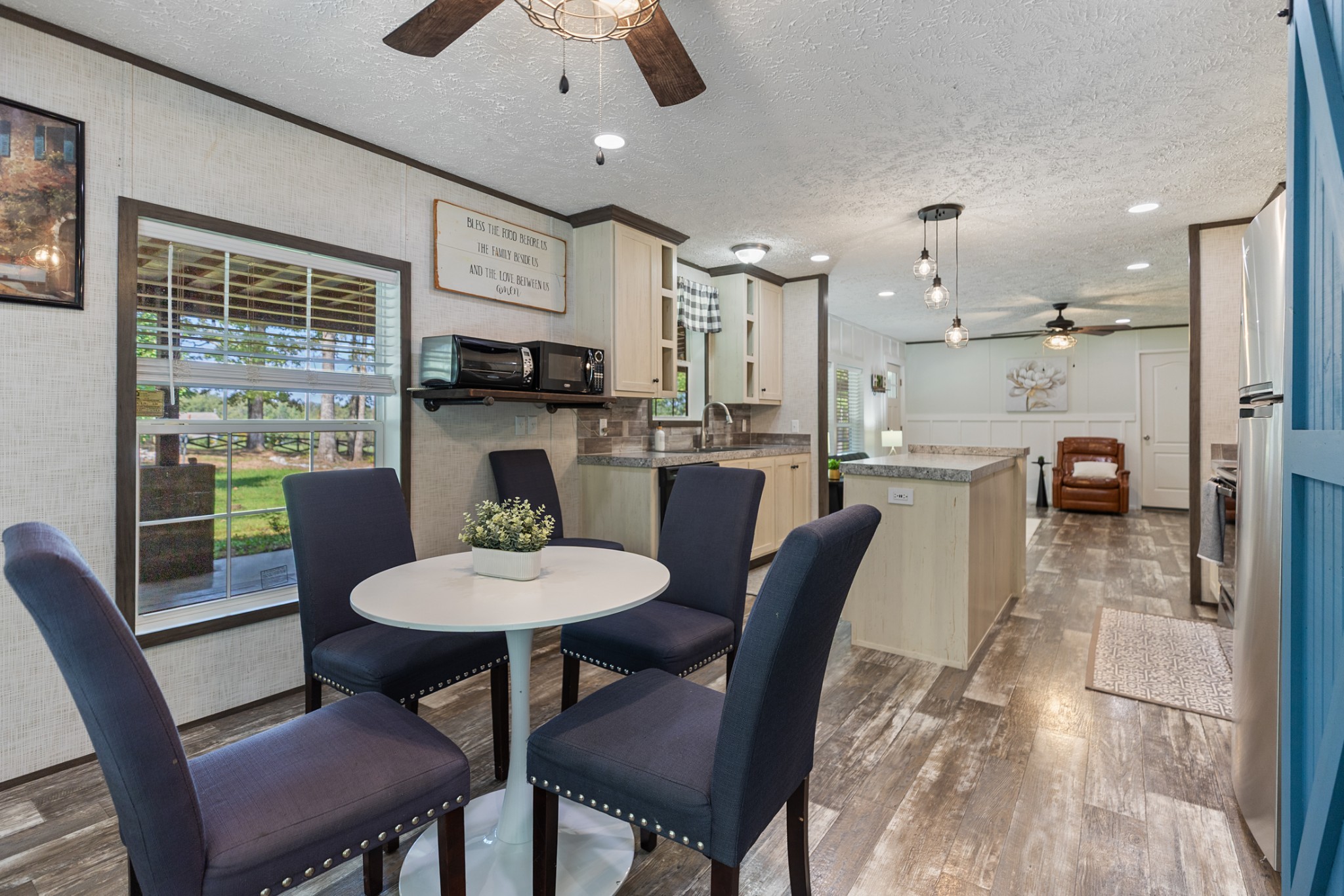 3844 Humphreys County Line Road Dickson, TN 37055 - Photo 16 of 57 a dining room with furniture a window and a kitchen view