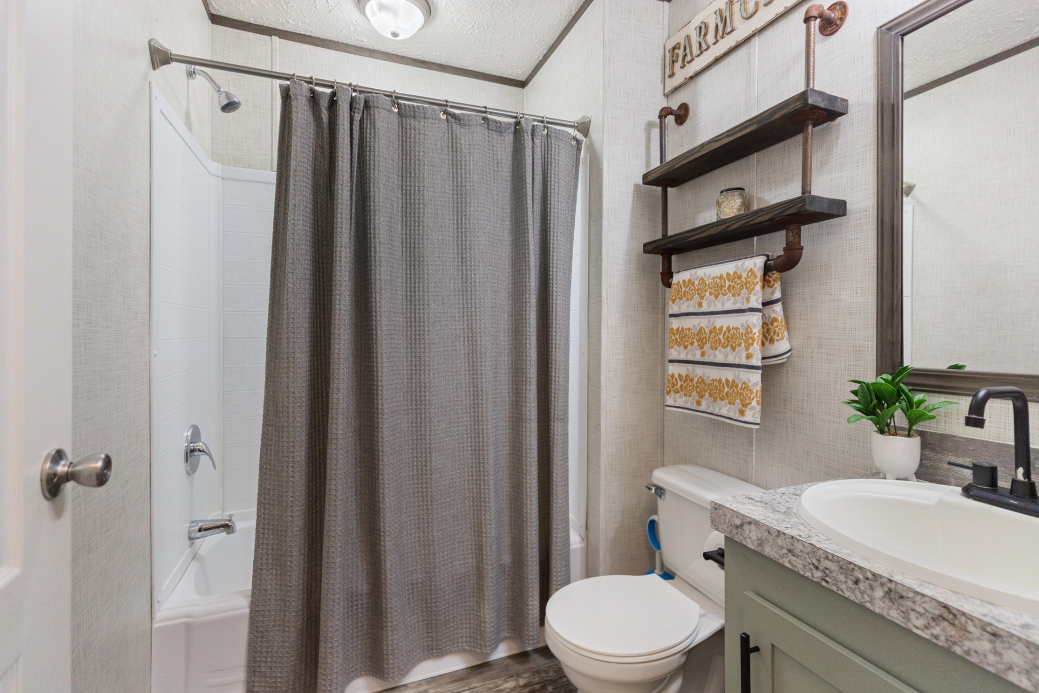 3844 Humphreys County Line Road Dickson, TN 37055 - Photo 25 of 57 a bathroom with a granite countertop sink toilet and shower