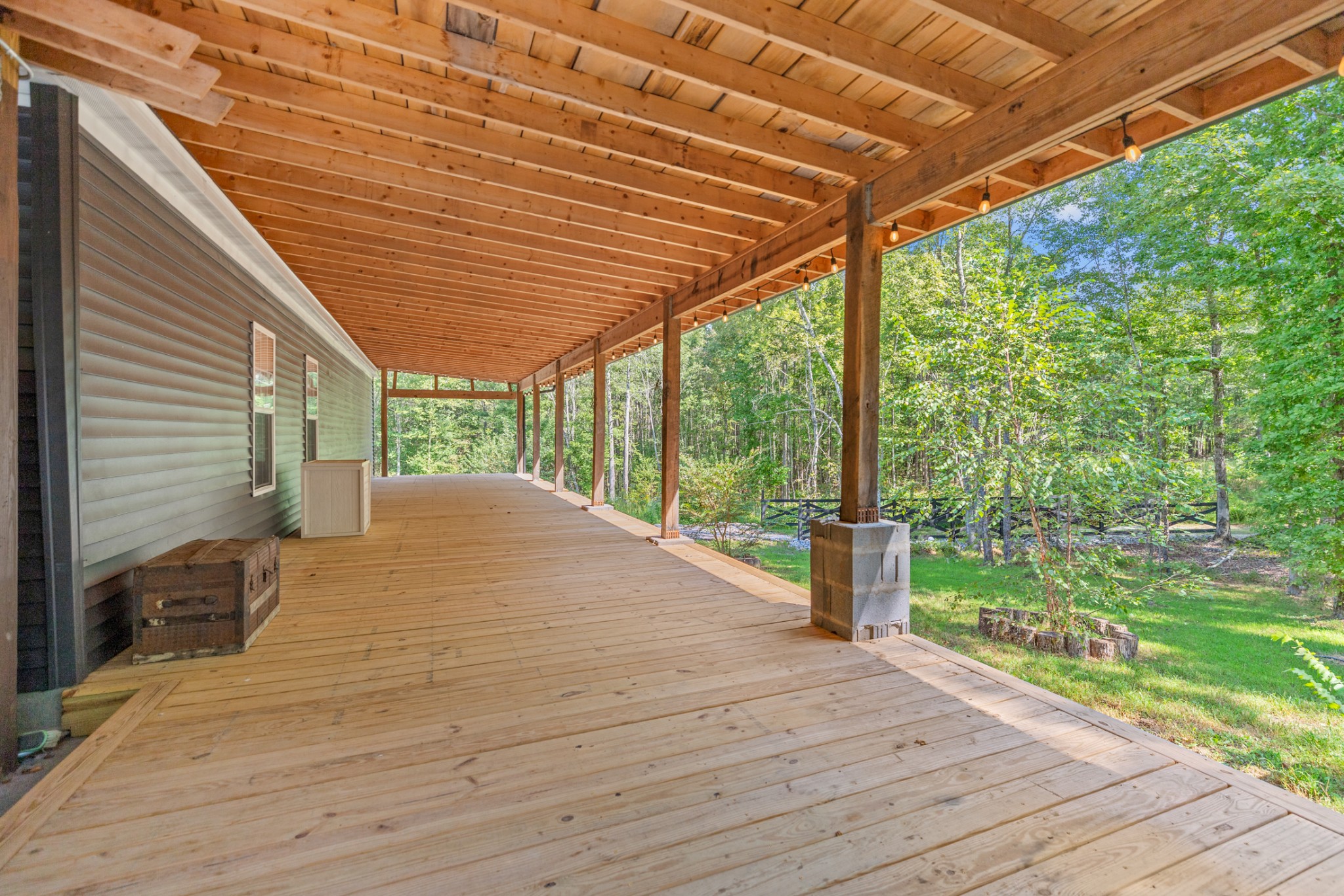 3844 Humphreys County Line Road Dickson, TN 37055 - Photo 29 of 57 a bedroom with a bed and a wooden floor