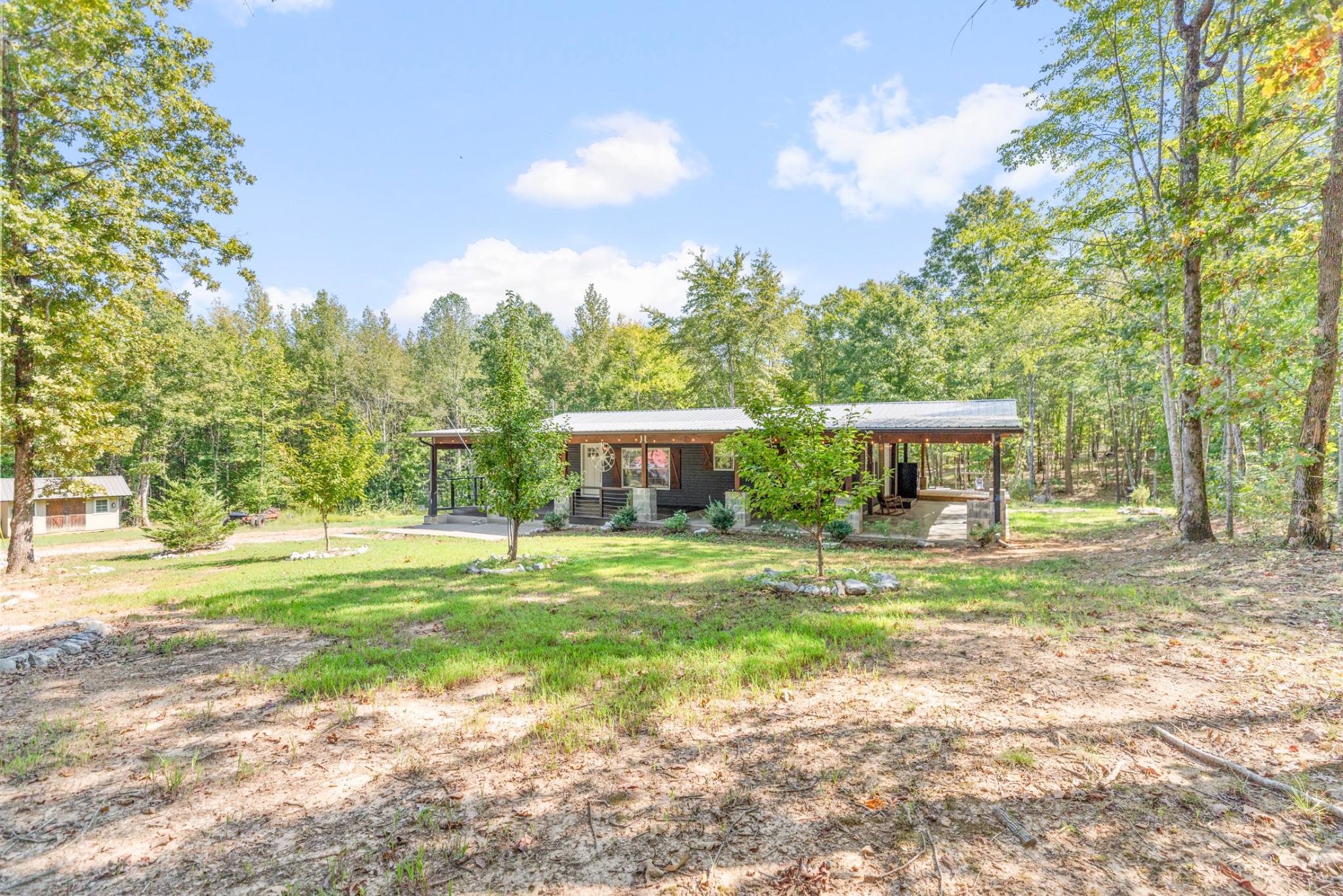 3844 Humphreys County Line Road Dickson, TN 37055 - Photo 4 of 57 a view of a house with garden and trees