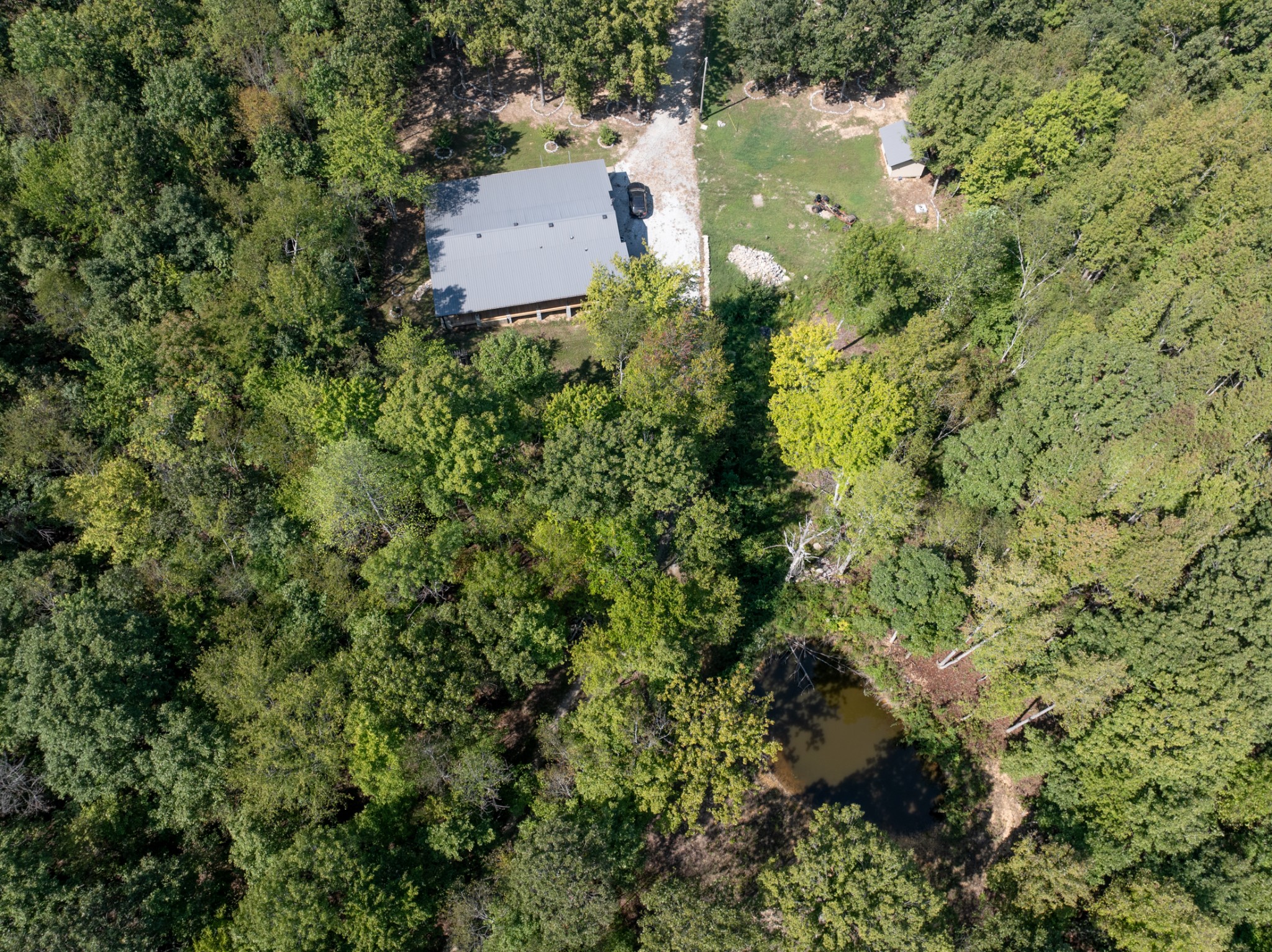 3844 Humphreys County Line Road Dickson, TN 37055 - Photo 41 of 57 an aerial view of residential house with outdoor space and trees all around