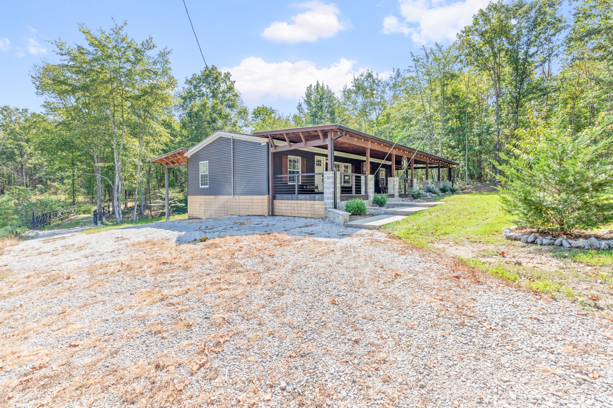3844 Humphreys County Line Road Dickson, TN 37055 - Photo 49 of 57 a front view of a house with a yard and trees