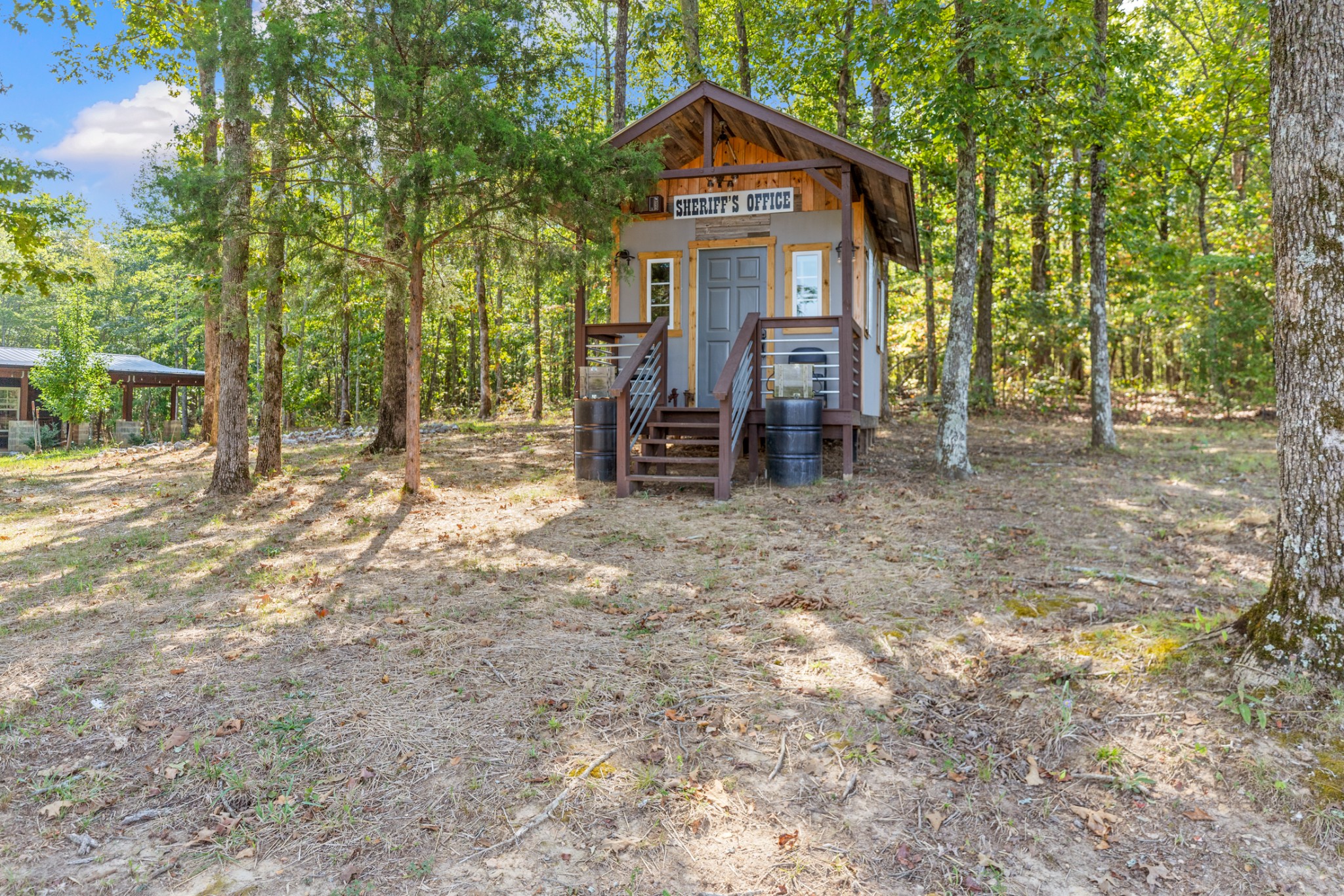 3844 Humphreys County Line Road Dickson, TN 37055 - Photo 51 of 57 a view of a house with a yard and large trees