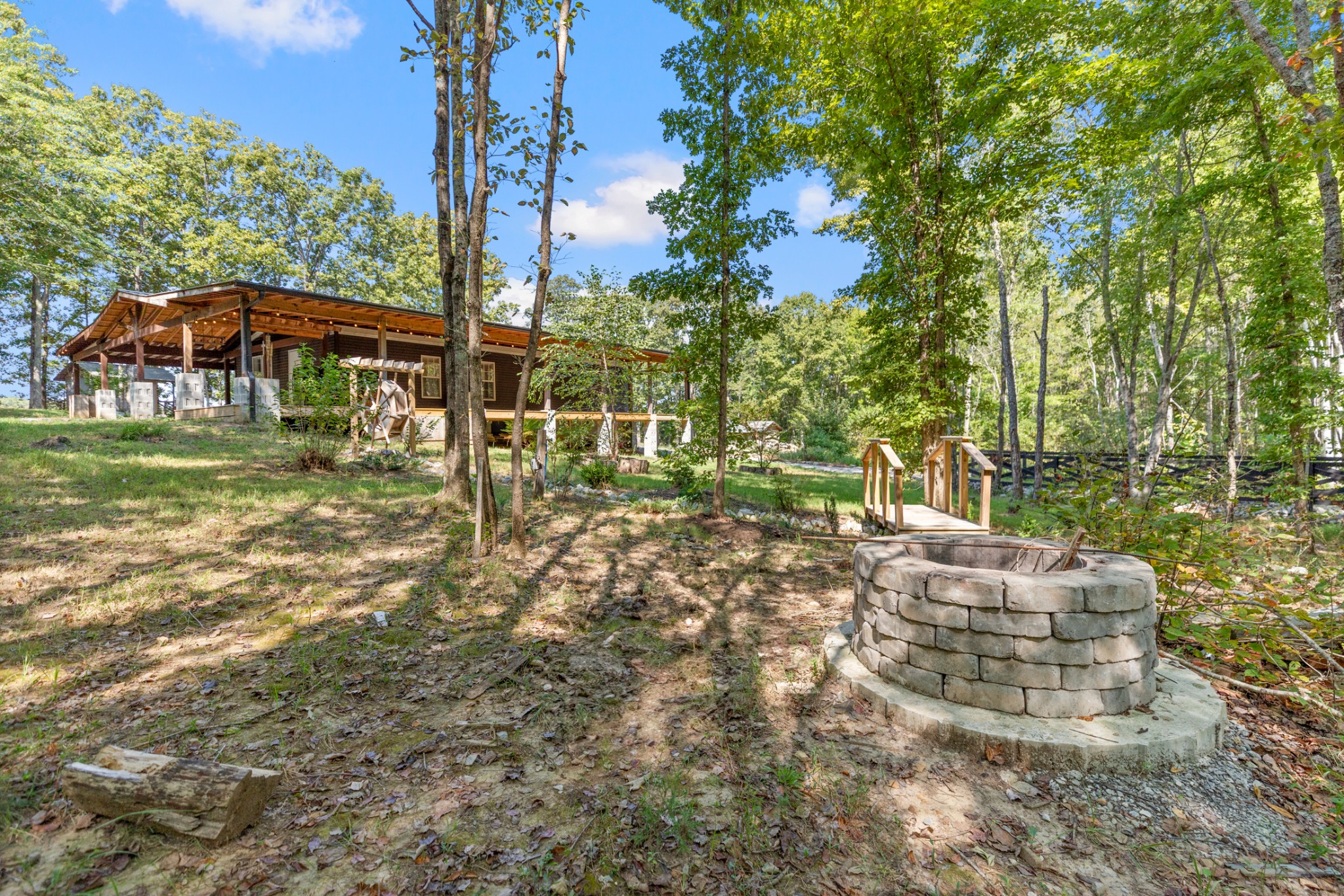 3844 Humphreys County Line Road Dickson, TN 37055 - Photo 55 of 57 a view of a table and chairs under an umbrella