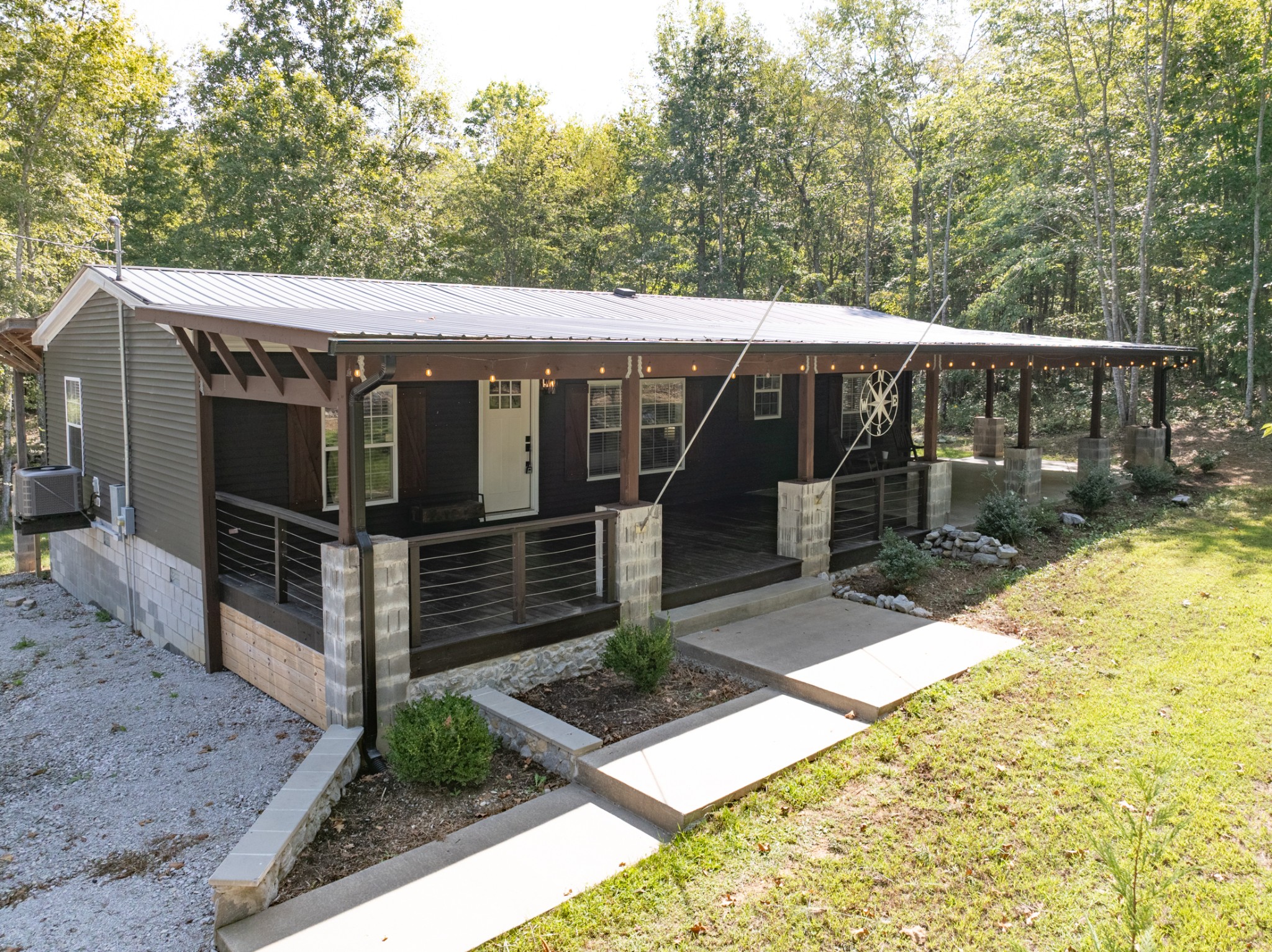 3844 Humphreys County Line Road Dickson, TN 37055 - Photo 56 of 57 a view of a small house with yard and wooden fence