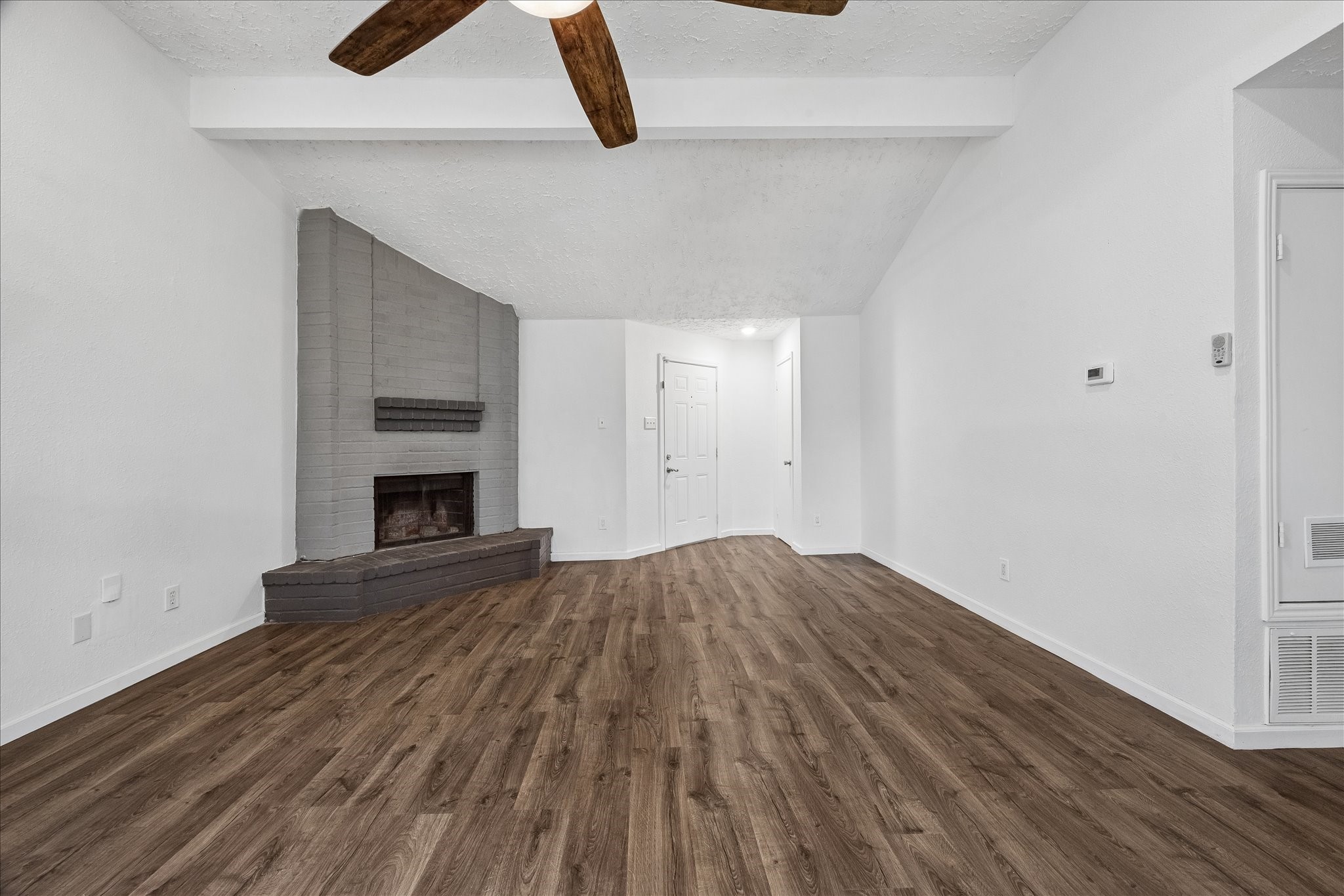 16715 Benchmark Drive Houston, TX 77053 - Photo 9 of 14 a view of empty room with wooden floor and fireplace