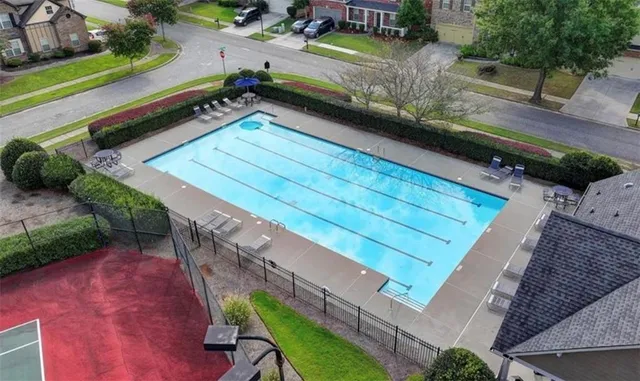 a view of a backyard with sitting area