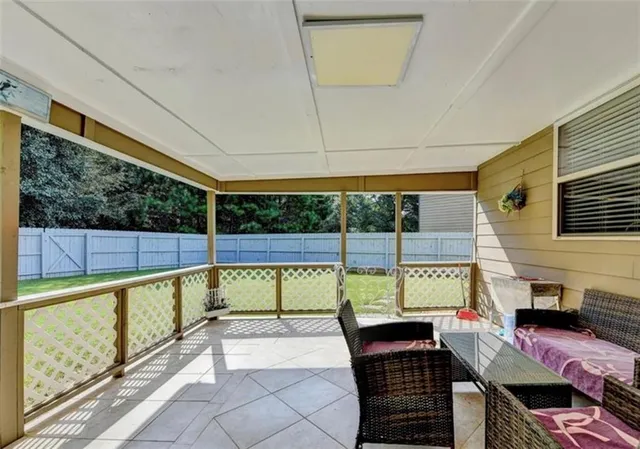 a view of swimming pool with seating area