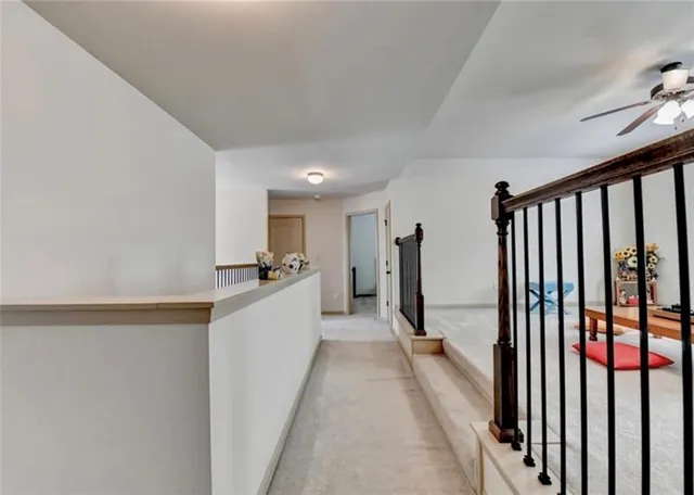 a view of a hallway with a dining room