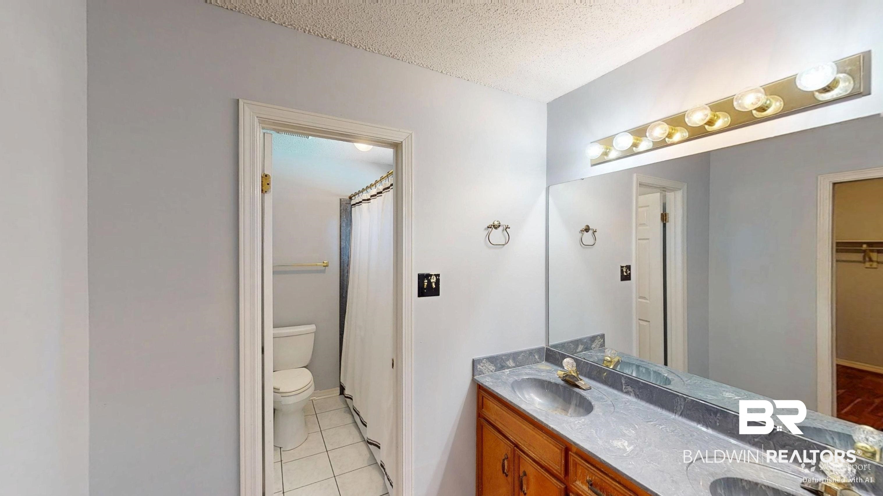 7310 Cheryl Court Mobile, AL 36695 - Photo 16 of 23 Bathroom featuring double vanity