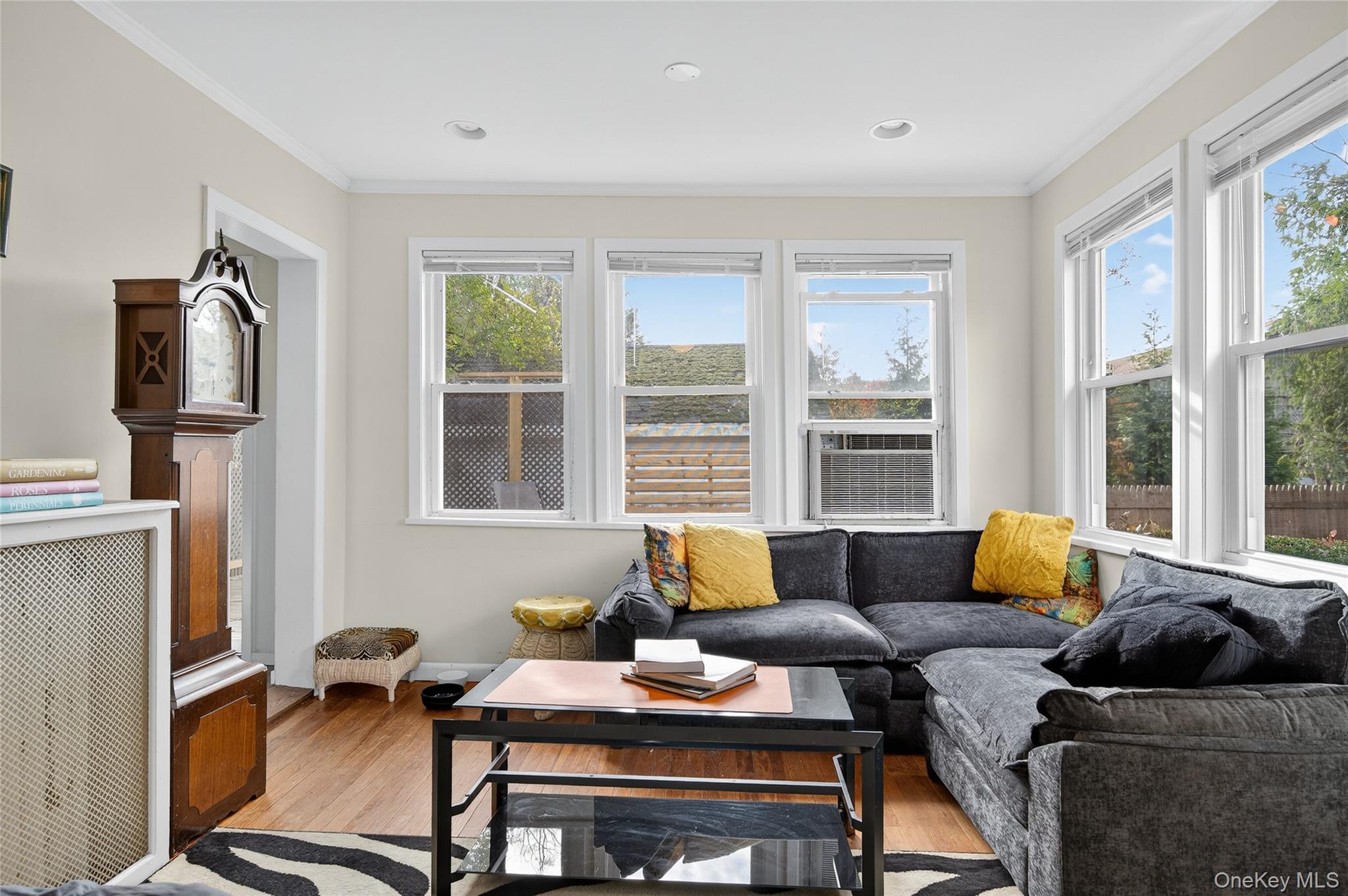 26 West 5th Street Locust Valley, NY 11560 - Photo 24 of 36 a living room with furniture and floor to ceiling windows