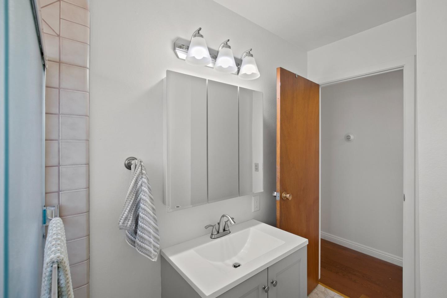 502 Ridgeview Avenue Marina, CA 93933 - Photo 15 of 20 a bathroom with a sink a mirror and vanity