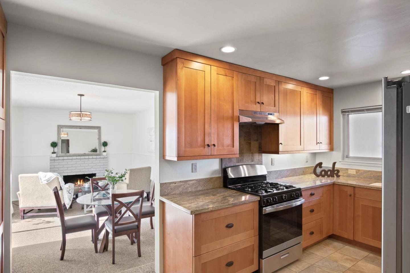 502 Ridgeview Avenue Marina, CA 93933 - Photo 4 of 20 a kitchen with stainless steel appliances granite countertop a stove a sink and a refrigerator
