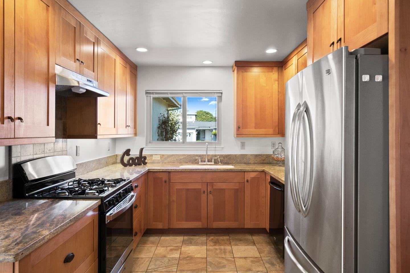 502 Ridgeview Avenue Marina, CA 93933 - Photo 5 of 20 a kitchen with stainless steel appliances granite countertop a sink stove and refrigerator