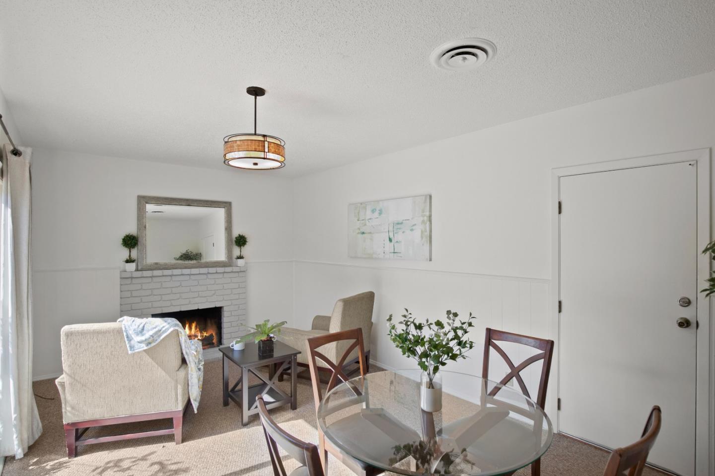 502 Ridgeview Avenue Marina, CA 93933 - Photo 7 of 20 a living room with furniture a fireplace and a table