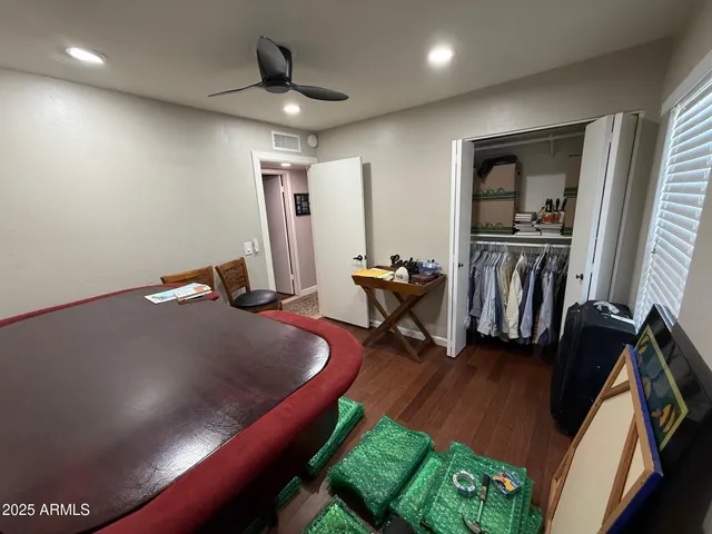 a bedroom with a bed and a chair