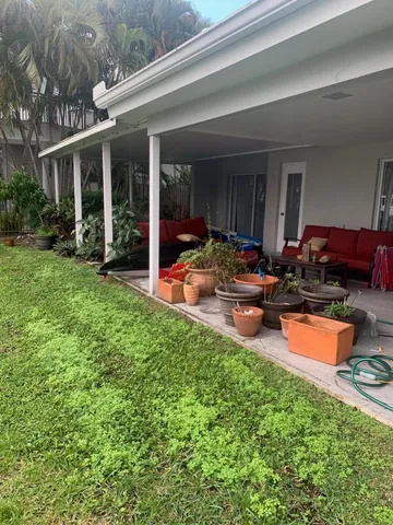 a backyard of a house with seating space