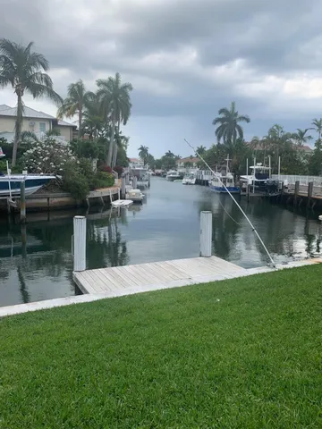 a view of a lake with a house in the background