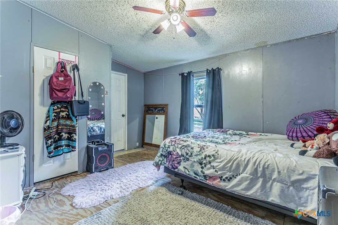 2811 Mimosa Drive Kempner, TX 76539 - Photo 15 of 27 a bedroom with bed and dresser