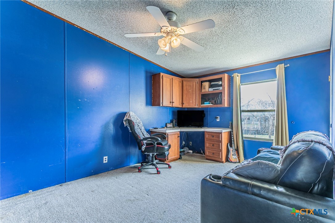 2811 Mimosa Drive Kempner, TX 76539 - Photo 17 of 27 a living room with furniture and a ceiling fan
