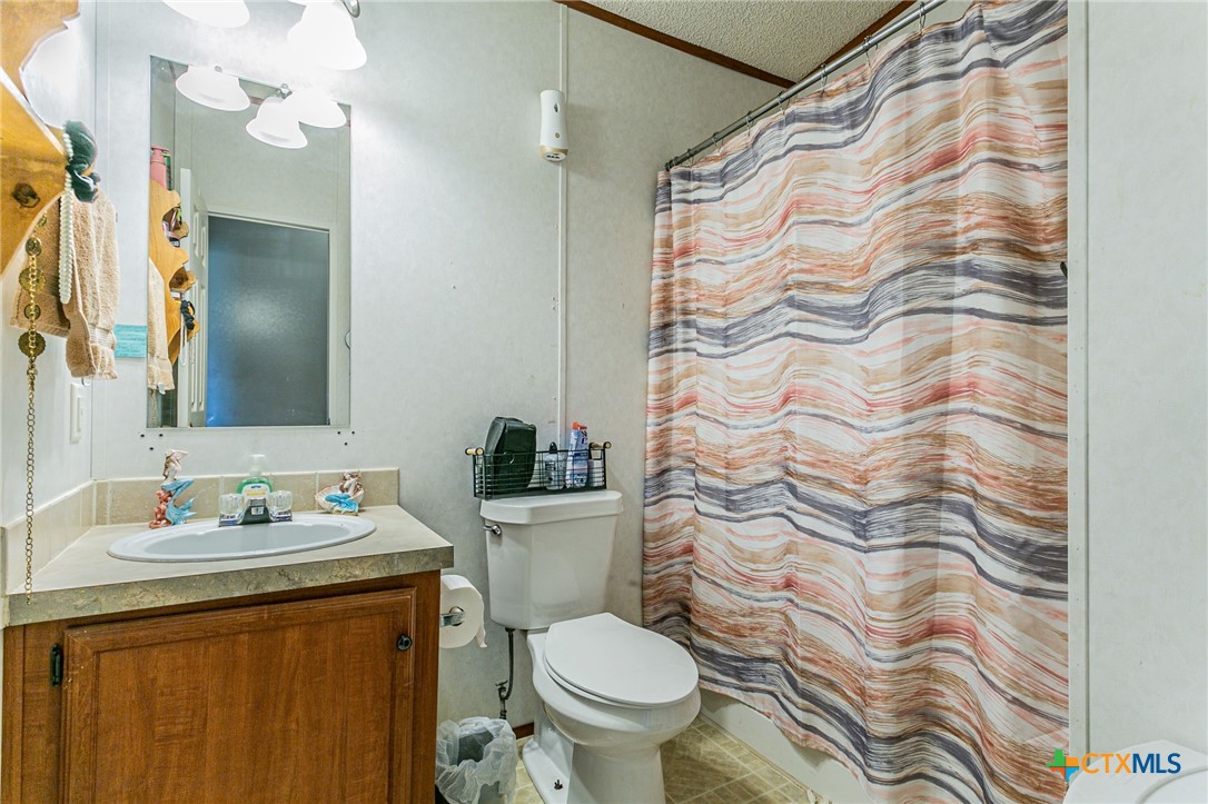 2811 Mimosa Drive Kempner, TX 76539 - Photo 19 of 27 a bathroom with a sink and toilet