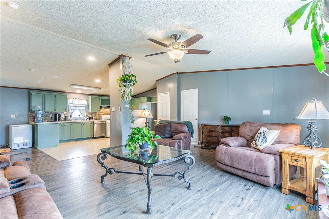 2811 Mimosa Drive Kempner, TX 76539 - Photo 7 of 27 a living room with furniture and a chandelier
