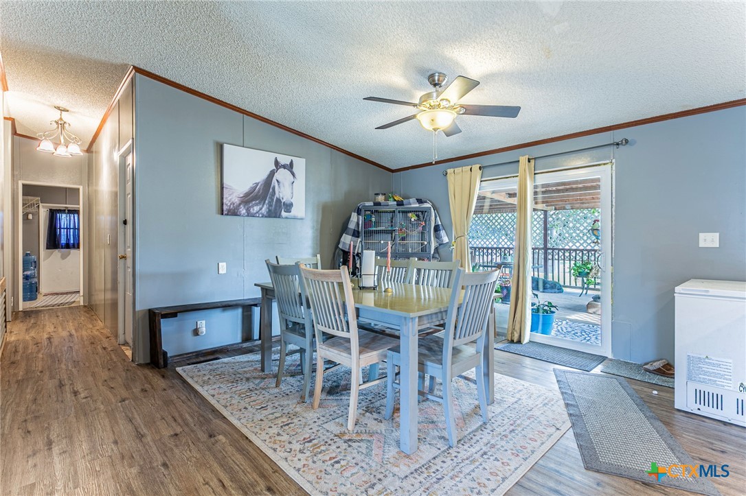 2811 Mimosa Drive Kempner, TX 76539 - Photo 10 of 27 a view of a dining room with furniture window and wooden floor