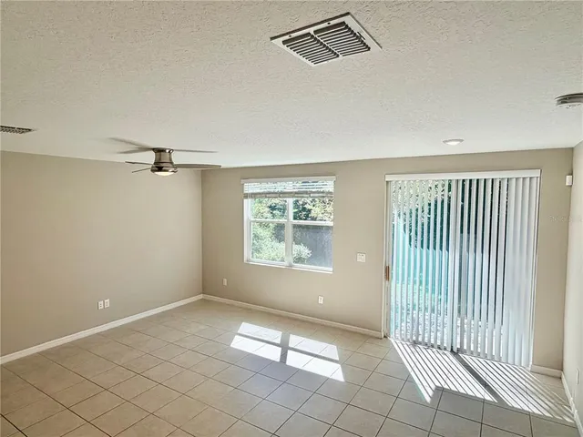 a view of kitchen with stainless steel appliances a refrigerator and a stove top oven