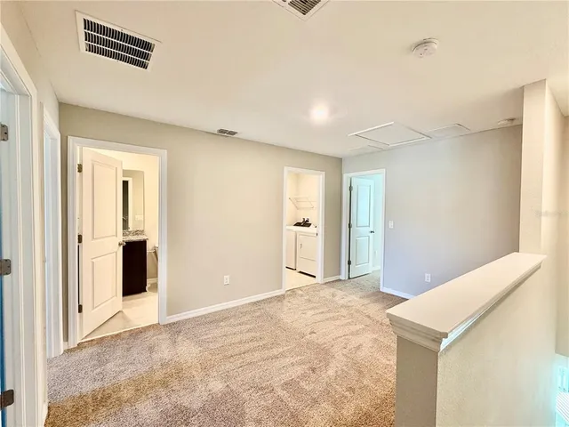 a bathroom with a granite countertop sink mirror and a shower