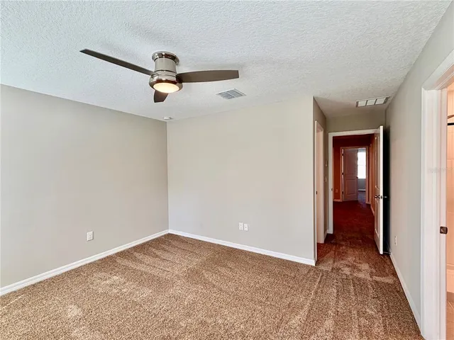 a bathroom with a granite countertop sink a shower and a mirror