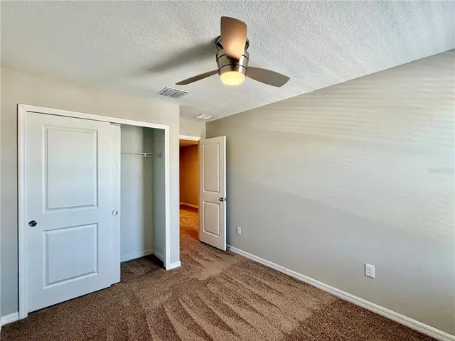 an aerial view of a city with lawn chairs
